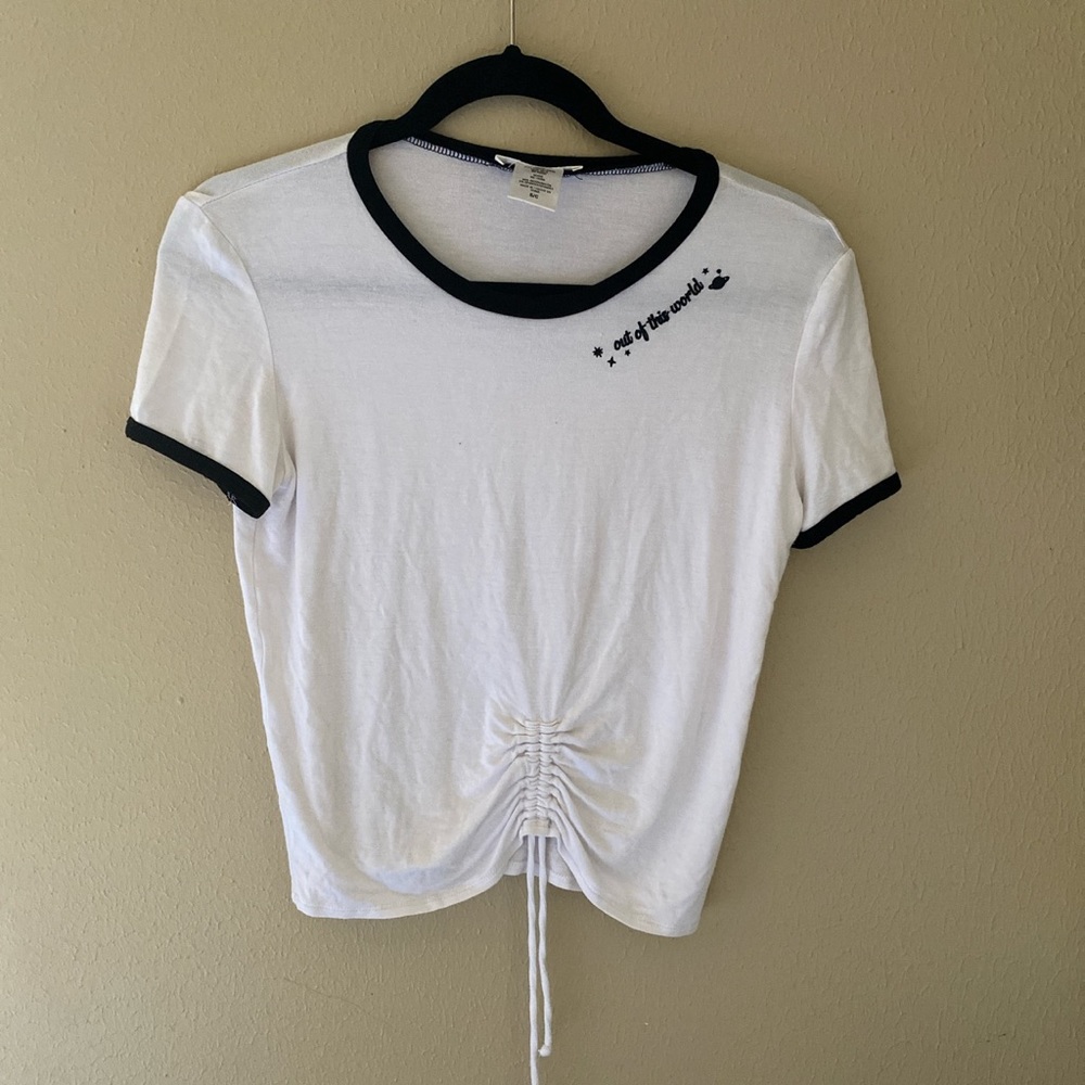 T Shirt with “Out of this world” embroidered on it